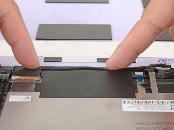 Use your fingers to press the display cable onto the display.