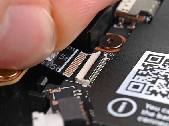 Slide the Audio Board cable straight into its socket.
