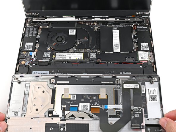 Position the Input Cover, keyboard down, on top of the Laptop so it just covers the battery.