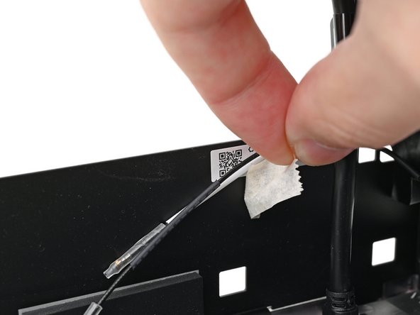 Peel off the tape covering the antenna cables.