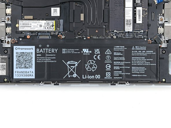 Use your Framework Screwdriver to loosen the three captive T5 Torx screws securing the battery.