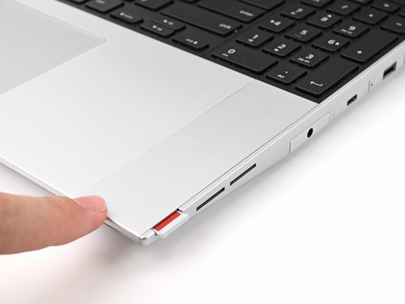 Repeat the same procedure for the other Touchpad Spacer.