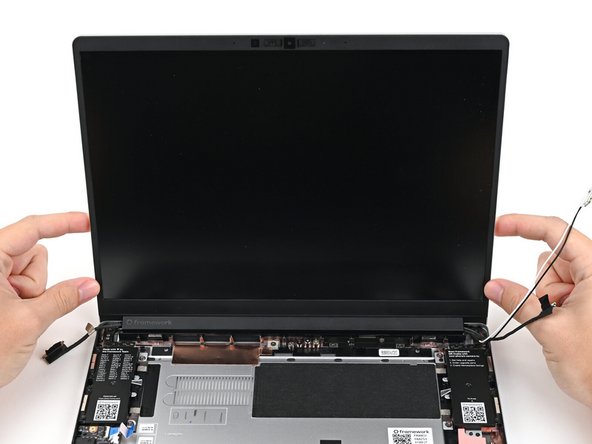 Lift the Top Cover off its two sets of alignment pegs on the Bottom Cover and remove it.