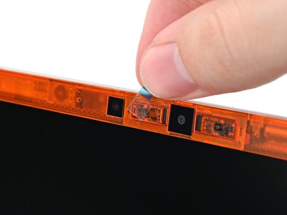 If there are any plastic liners covering the webcam and microphone, remove them.