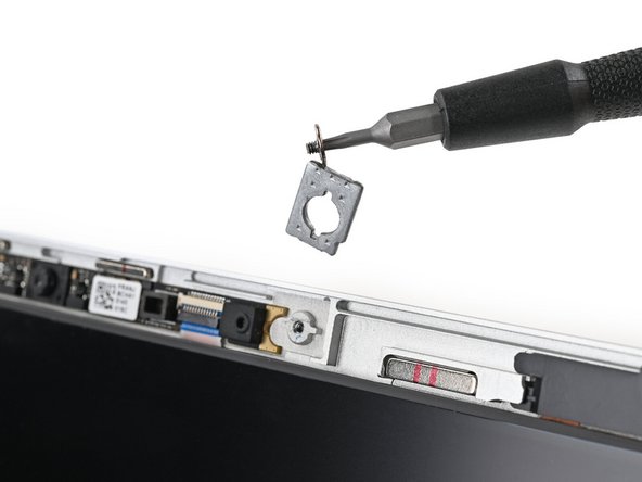 The washers underneath the screws are magnetic. If they come off with the screws, you can skip the next step.