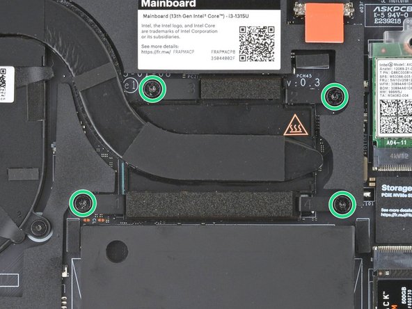 Use your Framework Screwdriver to loosen the four captive Torx T5 screws securing the Heatsink.