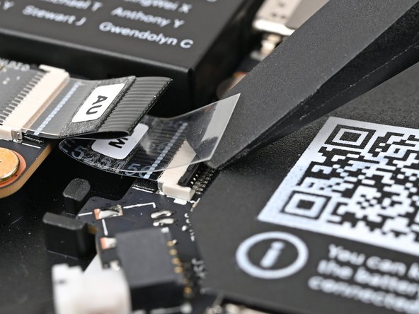 Use the flat end of your Framework Screwdriver, or a clean fingernail, to press down the locking tab on the Audio Board ZIF connector.