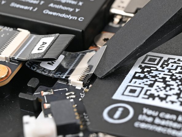 Use the flat end of your Framework Screwdriver, or a clean fingernail, to press down the locking tab on the Audio Board ZIF connector.