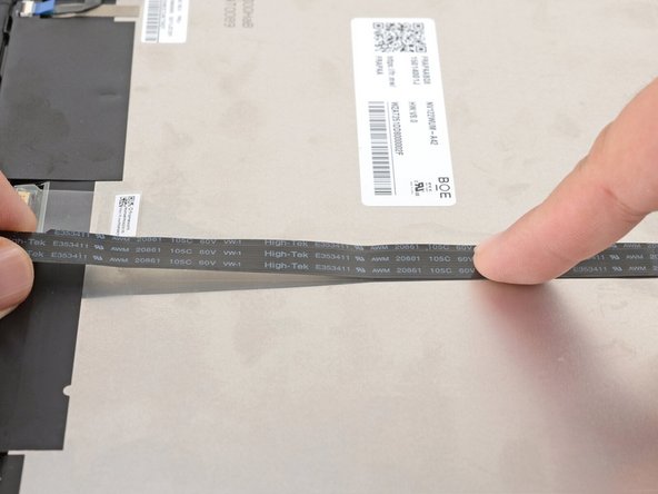 Use your fingers to press the webcam cable onto the display.