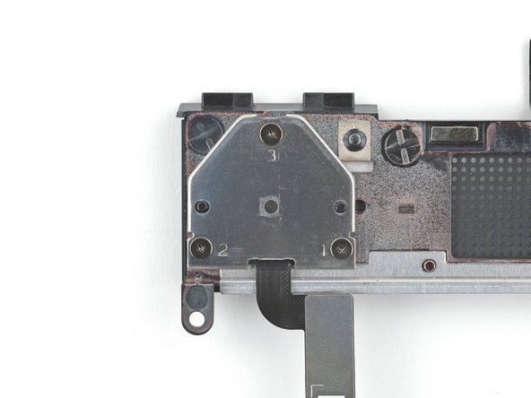 Use your Framework Screwdriver to install the three 2.0 mm‑long Phillips screws securing the fingerprint reader cover.