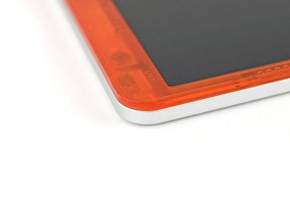 Use your fingers to press around the edge of the Bezel. The magnets should easily snap into place.