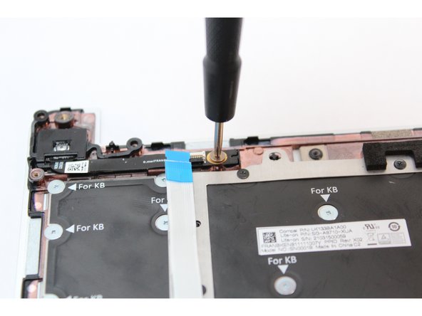 Using the PH0 bit in your Framework Screwdriver, screw the fastener into the Fingerprint Reader.