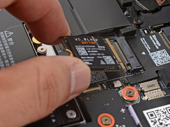 The next two steps show how to install the storage (aka SSD, or Solid State Drive).