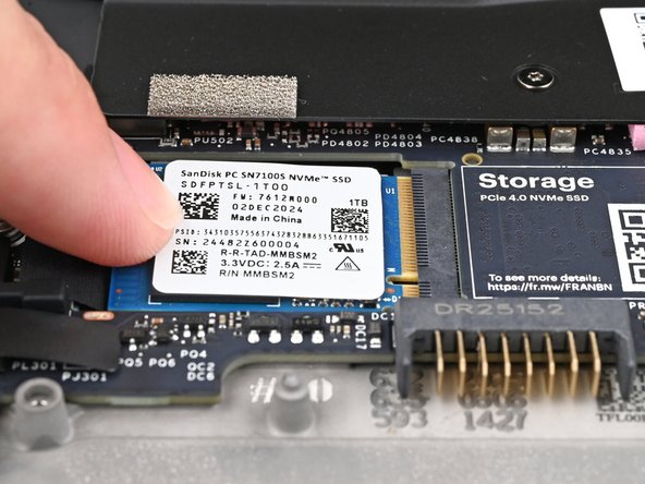 While keeping the SSD flat to the Mainboard, push it into its socket until its golden contacts are completely covered.