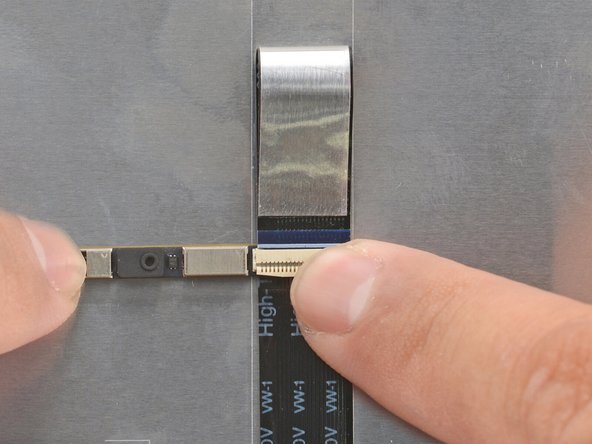 Use your finger to flip down and gently press the locking tab in place.