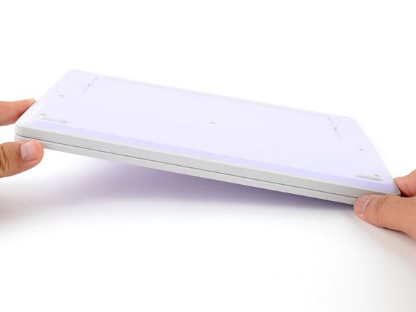 Set your Framework Laptop face-down on a clean work surface.