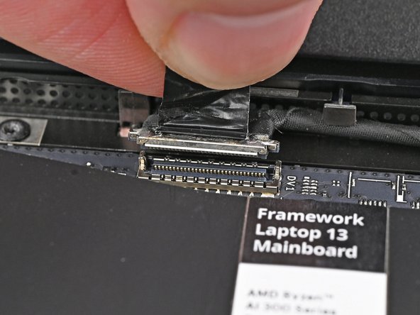 Press the Webcam Cable connector straight down into its socket to connect it.