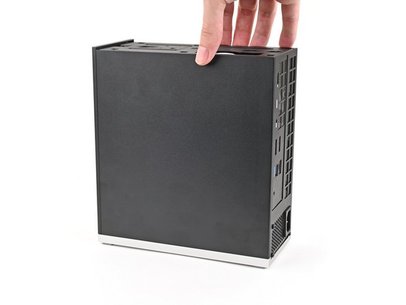 Lay down the Desktop on its side so the fan is facing upward.