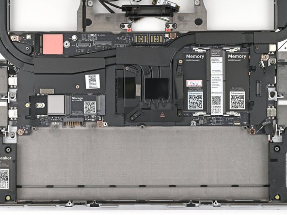 Use your Framework Screwdriver to remove the six 2 mm‑long T5 Torx screws securing the Mainboard.