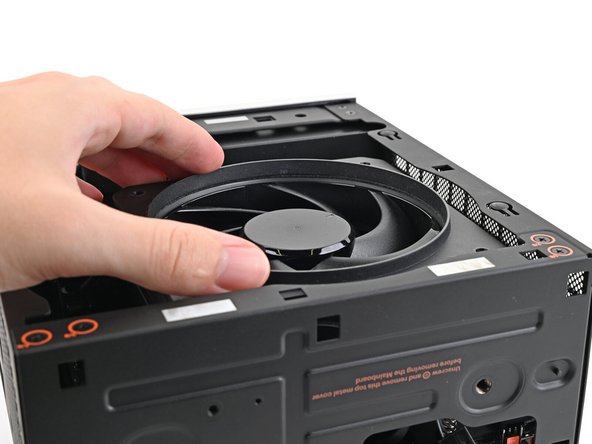 Align the screw holes on the fan duct with the ones on the fan.