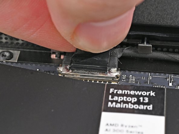 Press the Webcam Cable connector straight down into its socket to connect it.
