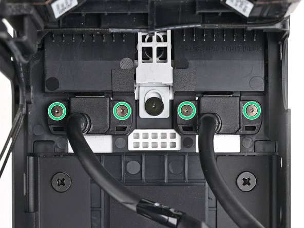 Use your Framework Desktop Screwdriver to loosen the four captive T5 Torx screws securing the two Expansion Card cables.