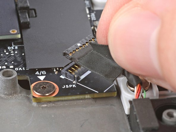 Press the speaker cable connector straight down into its socket to connect it.