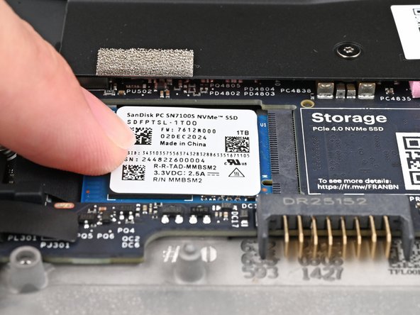 While keeping the SSD flat to the Mainboard, push it into its socket until its golden contacts are completely covered.