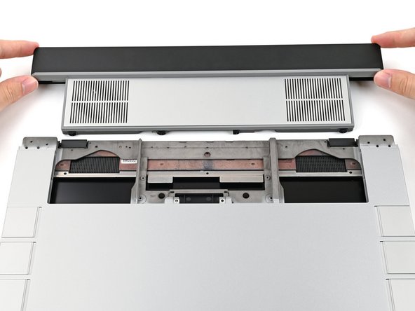 Align the Graphics Module with its slot in the laptop.