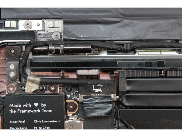 Route the black Display Cable through the routing channel as indicated in the picture.