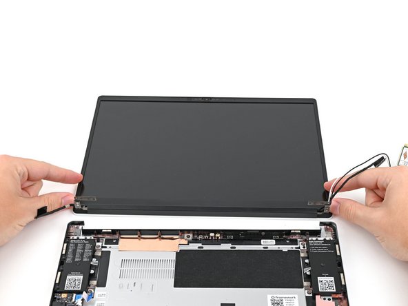Lift the Top Cover off its two sets of alignment pegs on the Bottom Cover and remove it.