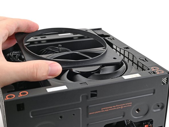 Lay the fan duct on top of the fan with the lip facing upward.