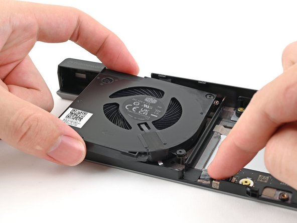 Use one hand to press the left fan cable flat to the module.