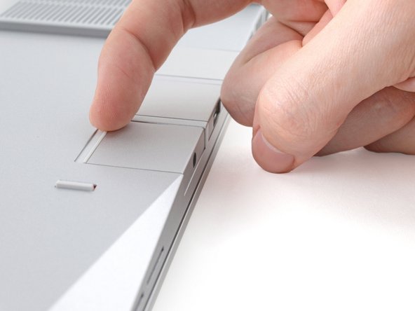 Grip the lip of the Expansion Card with your fingers.