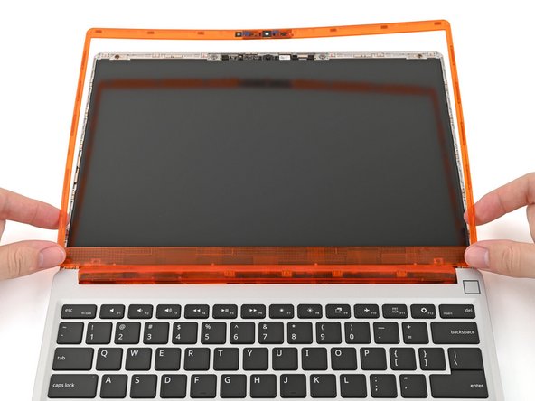 If there's any liners covering adhesive on the back of the Bezel, remove them now.