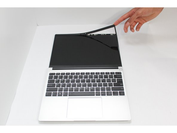 Open the Framework Laptop 180 degrees to remove the Bezel.