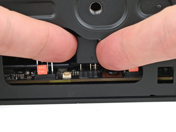 Use your fingers to lift the fan RGB cable connector off its three‑pronged socket on the Mainboard.
