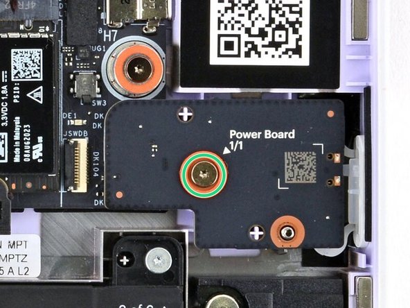 Use your Framework Screwdriver to tighten the captive T5 Torx screw to secure the Power Button Board.