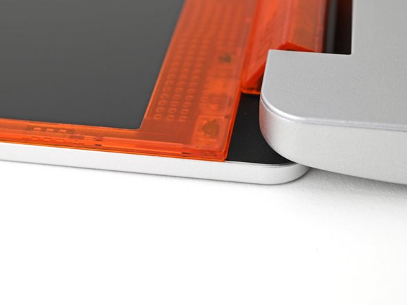 Check that all four corners of the Bezel sit flat on the Top Cover. If they're uneven, do the following: