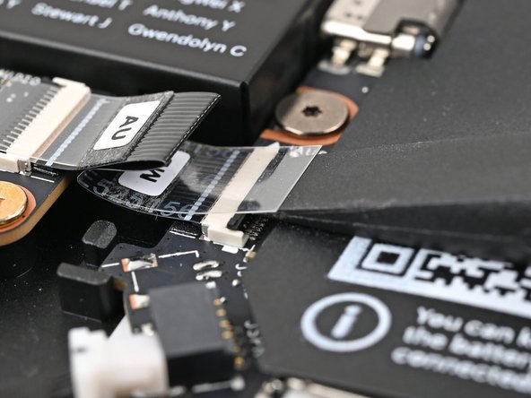 Use the flat end of your Framework Screwdriver, or a clean fingernail, to lift up the locking tab on the Audio Board ZIF connector on the Mainboard.