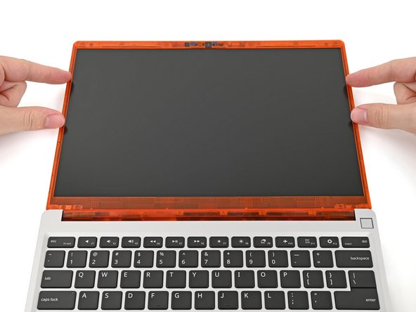 The bottom edge of the Bezel should sit flat and the magnets at its edges should "snap" into place.