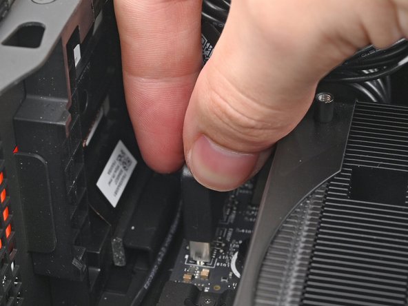 Pull the top Expansion Card connector straight out of its socket in the Mainboard to disconnect it.