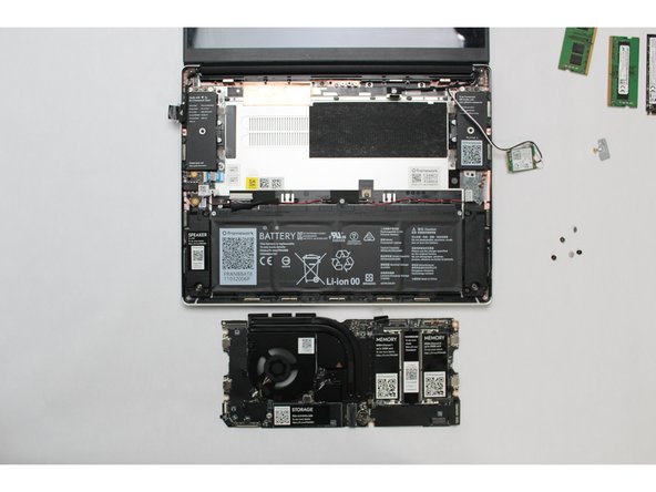 The components located underneath the Mainboard are highly sensitive.  Be sure to handle the board by the edges, and avoid touching any components on the board.