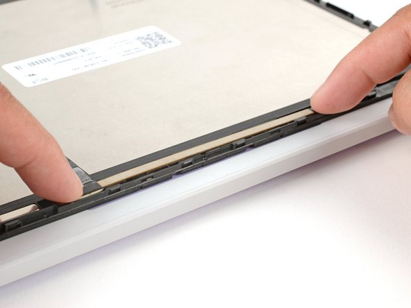 Use your fingers to flip the webcam back into its recess in the Top Cover.