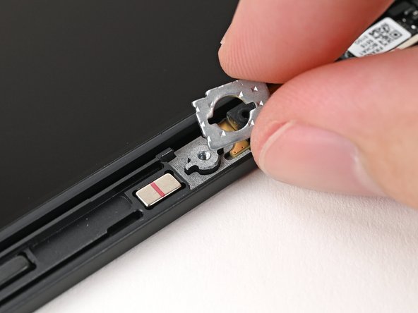 Use your fingers to remove the two washers off the Top Cover.