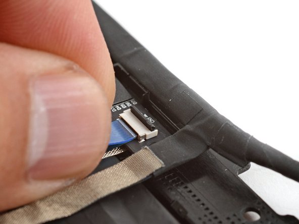 Use your finger to flip down and gently press the locking tab in place.