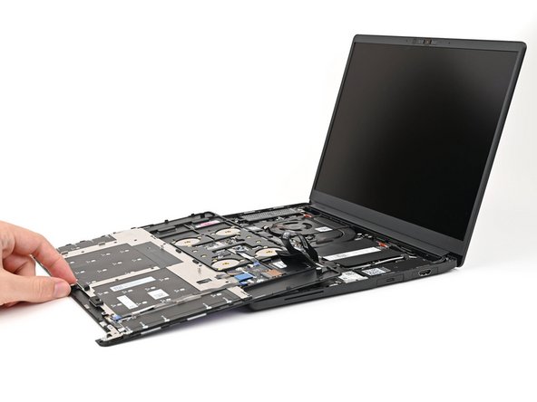 Rest the Input Cover over the Battery, making sure the Touchpad Cable isn't being strained.