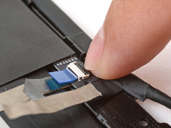 Use your finger to flip down and gently press the locking tab in place.