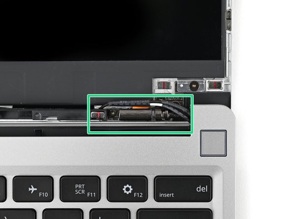 The Display Cable should be routed just above the hinge without any large gaps.