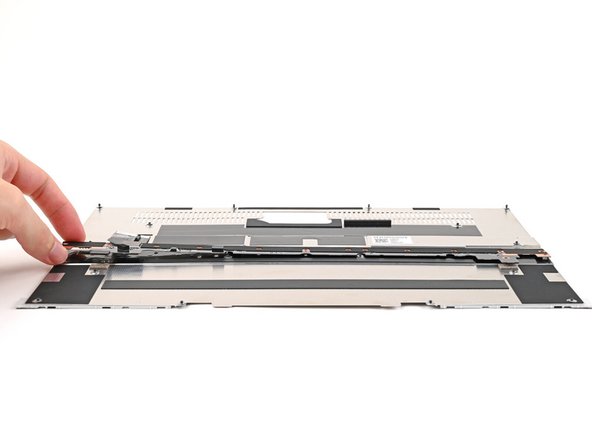 Place the Input Module Connector Board on the Mid Plate, making sure the connector is aligned with the hole in the Mid Plate.